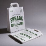 Flat handle paper bags personalised with custom branding
